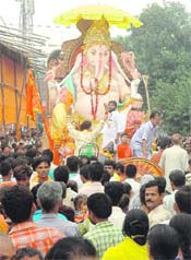 Devotees take a decorated idol of Lord Ganesha for immersion in the Satluj after the completion of Ganesh Puja in Ludhiana on Monday