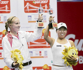Russias Alla Kudryavtseva (left) and USAs Vania King hold their trophies after winning the doubles title at the Sunfeast Open tennis tournament in Kolkata on Sunday. Vania and Alla beat Alberta Brianti and Mariya Koryttseva 6-1, 6-4 in the final. 