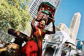A performer from India dances in front of a replica of the Taj Mahal set in central Manhattan as part of a promotional show in New York on Sunday.