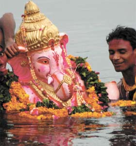 Devotees immerse an idol of Lord Ganesha in the Yamuna on the last day of the 10-day-long festival of Ganesh Chaturthi in the Capital
