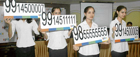 Models show the premium numbers thrown open for auction by Spice Telecom in Ludhiana on Tuesday