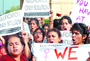 Students of various colleges of Delhi University shout slogans under the banner of Joint Action Committee during a demonstration at India Gate in the Capital on Wednesday. They were protesting against the police inaction in the molestation case. Tribune photo by Mukesh Aggarwal