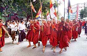 Buddhist monks march down a street in downtown Yangon on Wednesday, before police moved in to crack down on demonstrations