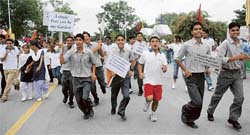 Students take part in a run organised by the Chandigarh Tourism Department at the Sukhna Lake, Chandigarh, on Thursday.