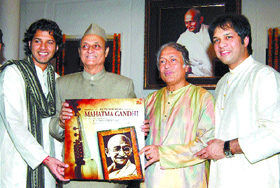 Dr Karan Singh and Ustad Amjad Ali Khan, flanked by his sons Amaan Ali (L) and Ayaan Ali, release the music album Remembering Mahatma Gandhi, a musical tribute to the Father of the Nation, in the Capital on Thursday. Tribune photo