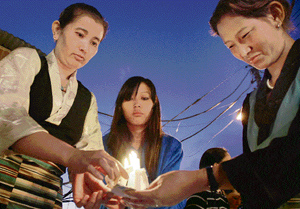 Members of the Tibetan Regional Youth Congress of Shimla and the Regional Tibetan Women Association take out a candle-light procession as a mark of respect to those who sacrificed their lives in the uprising on September 27, 1987, in Shimla on Wednesday.