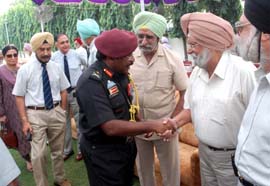 Lieut-Gen Noble Thamburaj interacting with ex-servicemen during a farewell organised by the District Sainik Welfare Association in Jalandhar on Thursday.