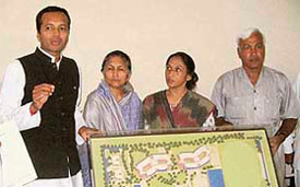 Congress MP Naveen Jindal and his mother, housing minister Savitri Jindal, show a birds eye view plan of the aborted school project in Hisar on Friday.