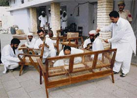 Inmates busy in repair work of Corbusier’s furniture at a workshop of Model Jail, Burail, in Chandigarh