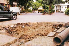 The road gully on the main road awaits repair by the Municipal Council in Mohali