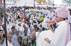 Rohtak MP Deepender Singh Hooda addresses a public meeting at Kalanaur on Friday to mobilise people for the bijli rally to be addressed by Congress president Sonia Gandhi in Jhadli village of Jhajjar