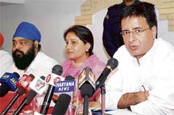 Haryana minister of power and public health Randeep Singh Surjewala along with Meena Mandal, minister of state for archaeology and museums , addresses a press conference in Karnal
