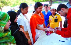 Young girls being examined in a free medical camp Team up for Healthy Heart for blood sugar, blood pressure and heart-related diseases on the occasion of World Heart Day, at Shanti Van in the Capital on Sunday.