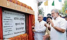 Chief Minister Bhupinder Singh Hooda lays the foundation stone of a grain market at Rajound in Kaithal district on Sunday.