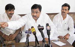 Haryana Confed chairman Bajrang Das Garg addresses a press conference in Hisar on Sunday.