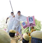 Activists of the All-India Sikh Conference protest against the clean chit given to Congress leader Jagdish Tytler in the 1984 riots, in New Delhi on Sunday.