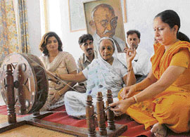 An old woman spins yarn on Gandhi Jayanti at Gandhi Samark, Sector 16, Chandigarh, on Tuesday.