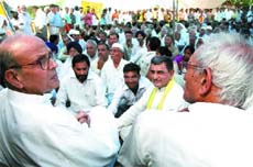 Former Prime Minister V.P.Singh along with activists of the Jan Morcha on dharna in front of Rajghat against the UPA government's agriculture policy, in the Capital on Tuesday. 