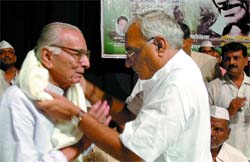 Haryana Chief Minister Bhupinder Singh Hooda felicitating freedom fighters at a function organised by the All India Youth Welfare Society in association with the All India Freedom Fighters Organisation and the All India Freedom Fighter Successors Organisation to mark the birth anniversary of the Father of the Nation, Mahatma Gandhi in the Capital on Tuesday