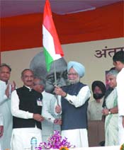 Prime Minister Manmohan Singh flags off a march of the Congress party workers to mark International Day of Non-Violence in the Capital on Tuesday.