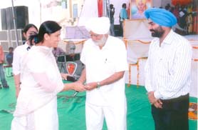 A war widow being honoured in a function in Jalandhar.