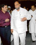 (Right) The chairman of the joint parliamentary committee on wakf, S.M. Laljan Basha, has a word with the chairman of the Chandigarh wakf board, Mansoor Ali, at the Chandigarh railway station on Wednesday.