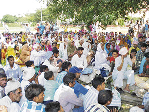 Supporters of Dera Sacha Sauda chief Gurmeet Ram Rahim Singh gather near Aggarsain Chowk in Ambala on Wednesday ahead of his arrival for appearance in court on Thursday