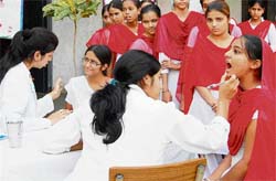 A team of doctors from CMCH examine students at Ramgarhia Girls College in Ludhiana