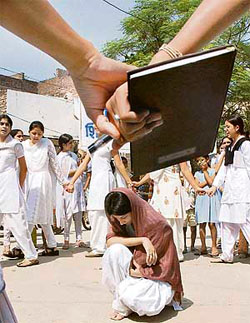 NSS volunteers present a play on female foeticide in Ambedkar Basti in Karnal on Thursday.