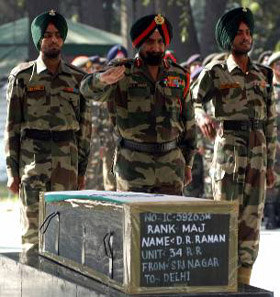 Lt-Gen A.S. Sekhon, GOC 15 Corps, salutes Major D.R. Ramans Coffin at the Army base camp in Srinagar on Thursday