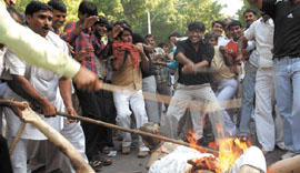 Members of the Gujjar community beat up an effigy of Rajasthan Chief Minister Vasundhara Raje in the Capital i on Saturday.