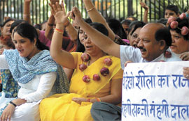 Activists of BJP Mahila Morcha stage a dharna at Parliament street to protest against the Delhi governments failure to arrest the price rise of vegetables on Saturday., in New Delhi on Saturday.