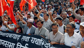 Communist Party of Nepal (UML) supporters chant slogans during a demonstration to protest against the postponement of Constituent Assembly elections in Kathmandu on Friday.