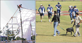 The umpire delivered his first decision demanding the tent be removed as it impeded the vision to the dressing room; and right: A team carries out a security check on the eve of the ODI in Sector 16 stadium on Sunday
