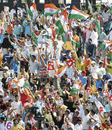 Fans celebrate the victory at the Sector 16 Cricket Stadium in Chandigarh on Monday.