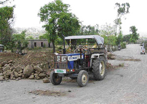 Tractors carry quarry material.