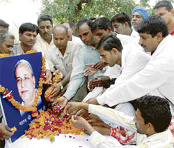 Workers of the BSP pay homage to Kanshi Ram on his first death anniversary at Karan Park in Karnal on Tuesday.