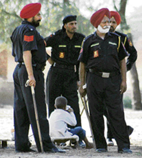 Commandos were deployed at Behman Jassa Singh village, Bathinda, as a preventive measure on Tuesday. A child enjoys tea unaware of the gravity of the situation