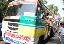 BJP leader Vijay Goel with Vijay Jolie operate a special Blueline bus (without tying a seat belt ) from the Red Fort to Delhi Chief Ministers house in the Capital on Wednesday.