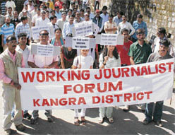 Kangra district journalists and press photographers hold a rally at Dharamsala on Wednesday in protest against the sedition case against the editor and reporter of Divya Himachal.