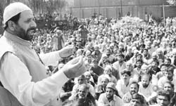 PDF chairman and J&K transport minister Hakeem Mohmmad Yaseen addresses supporters at his residence in Srinagar