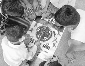 HIV+ children cutting a birthday cake in Chandigarh.