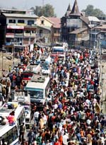 Kashmiri Muslims shop at Hari Singh Street in Srinagar