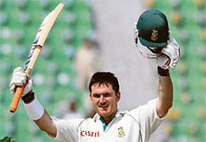 South Africas Graeme Smith acknowledges the crowd after completing his century on the fourth day of the second Test against Pakistan in Lahore on Thursday.