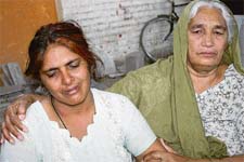 The mother of Naveen, who was stabbed to death at a cinema house in Rohtak, wails at the PGI on Friday.