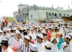 Muslim devotees come out after offering namaz at a masjid on the last Friday of Ramzan in Gurgaon. 