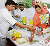 A woman seeks information about a product during the kisan mela in Karnal on Friday.