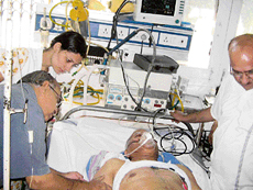 Doctors attend to former Haryana minister Hari Singh Saini at a private hospital in Hisar where he was admitted following a road accident on Saturday