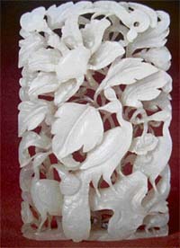 Five birds among peony blossoms: openwork ornament made of snow-white jade. Yuan dynasty; 13th century; China