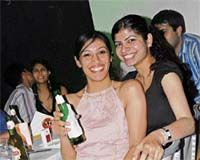 Techies have an evening out while a couple can be seen getting cosy in the background.